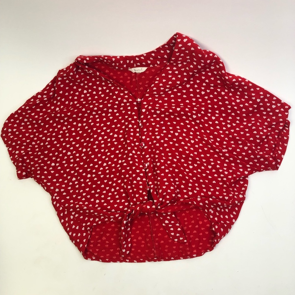 Red tie front shirt with white heart pattern